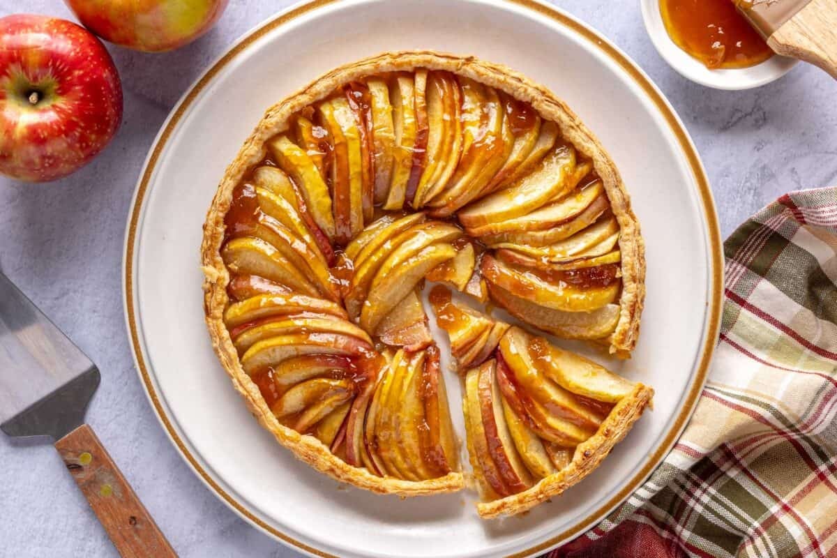 Baked apple tart topped with apricot jam.