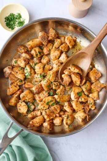 Easy seasoned chicken bites in a skillet.
