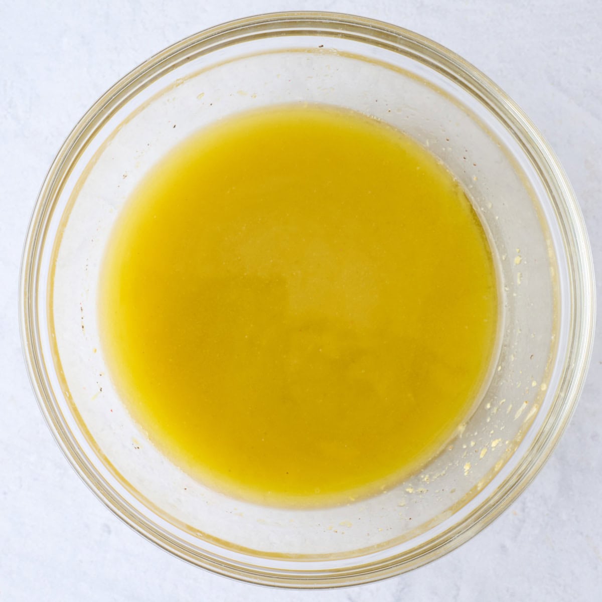 Vinaigrette after emulsified with extra virgin olive oil.