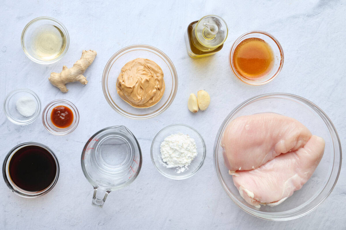 Ingredients for recipe: boneless skinless chicken breasts, cornstarch, salt, avocado oil, water, creamy natural peanut butter, soy sauce, honey, rice vinegar, garlic, ginger, sriracha.