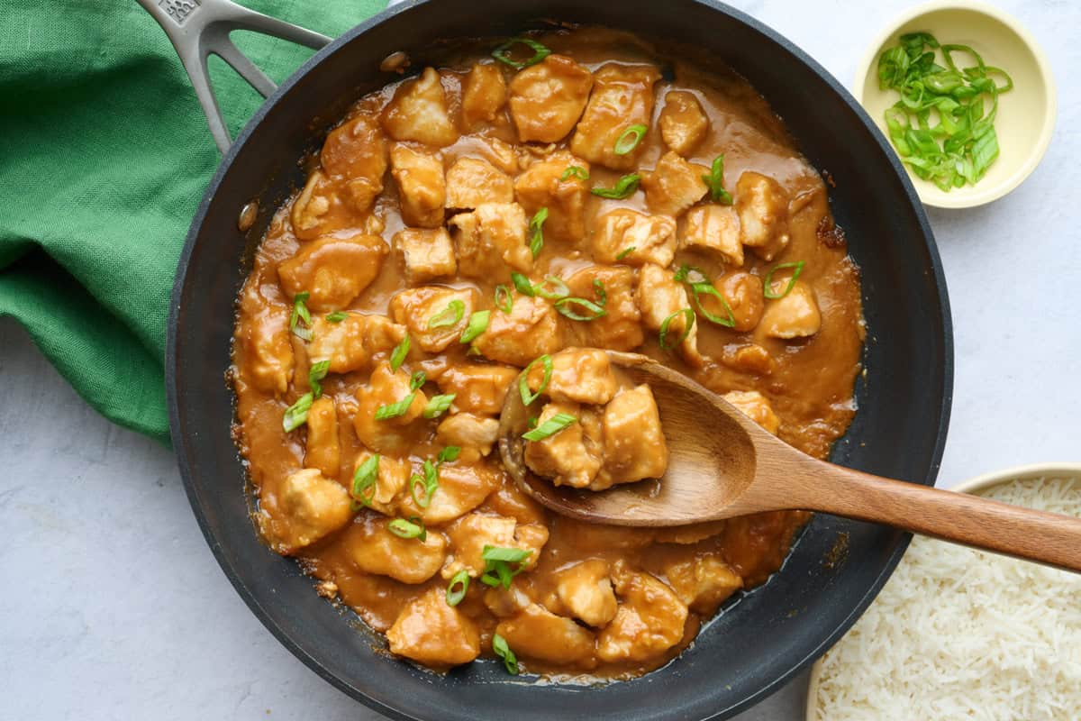 Chicken breast pieces cooked in a peanut butter sauce.