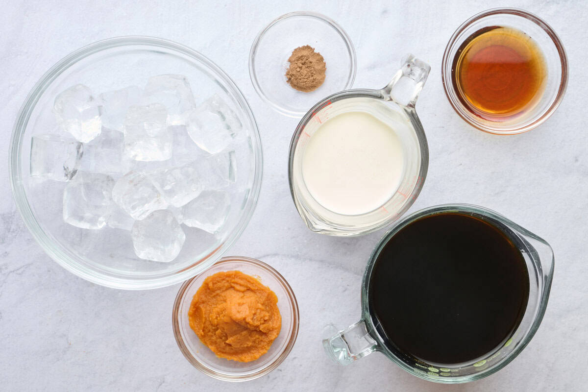 Ingredients for recipe: ice, pumpkin puree, pumpkin pie spice, heavy cream, maple syrup and cold brewed coffee.