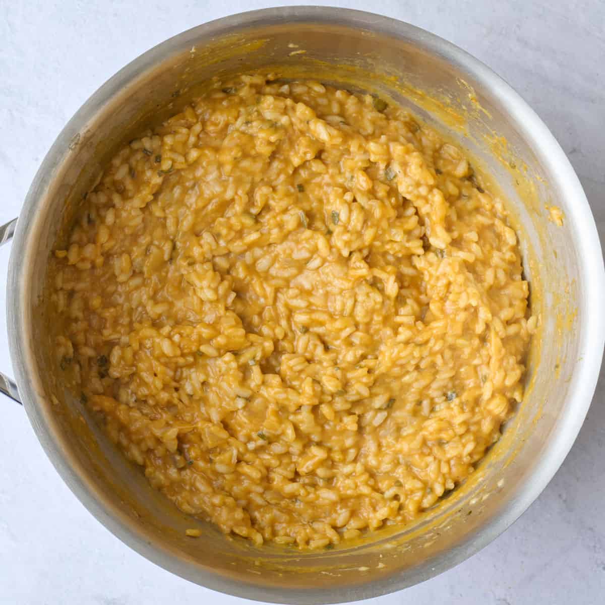 Easy pumpkin risotto recipe after mixing into a creamy side dish.