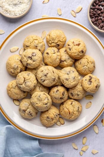 Best almond joy cookies made with shredded coconut, chocolate chips and sliced almonds on a large serving plate.