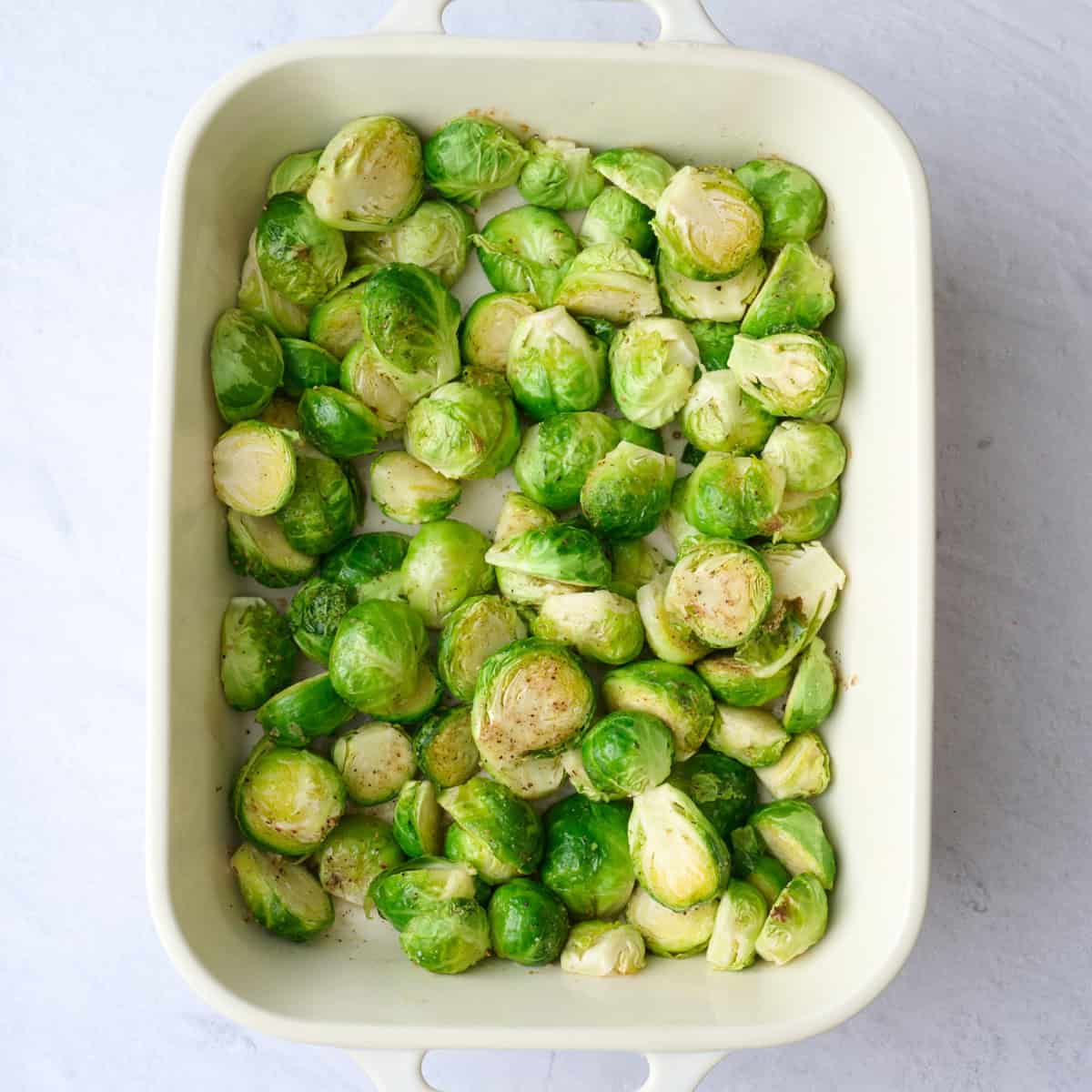 Brussel sprouts after roasting in a baking dish for casserole.