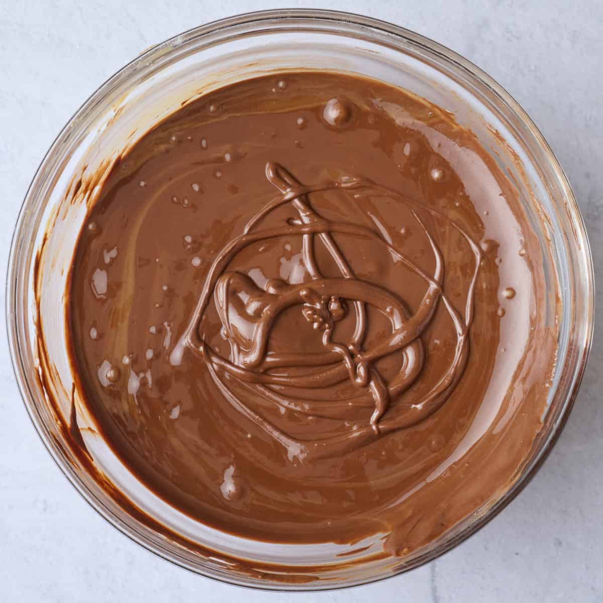 Chocolate peanut butter topping for bar after melting.