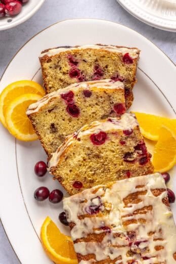 Moist cranberry orange bread after slicing to show inside texture of dessert bread.