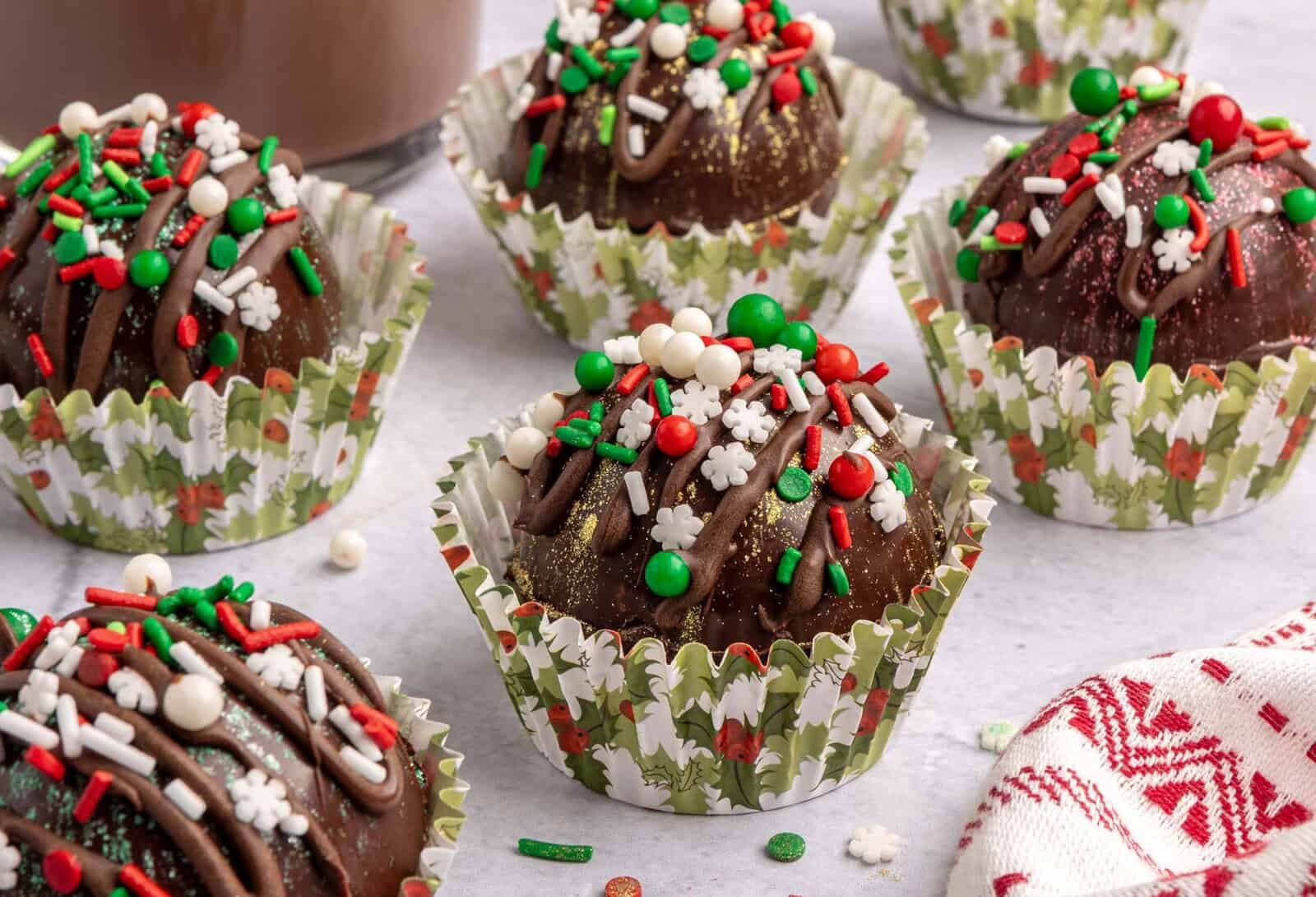 DIY hot cocoa bombs with holiday sprinkles.
