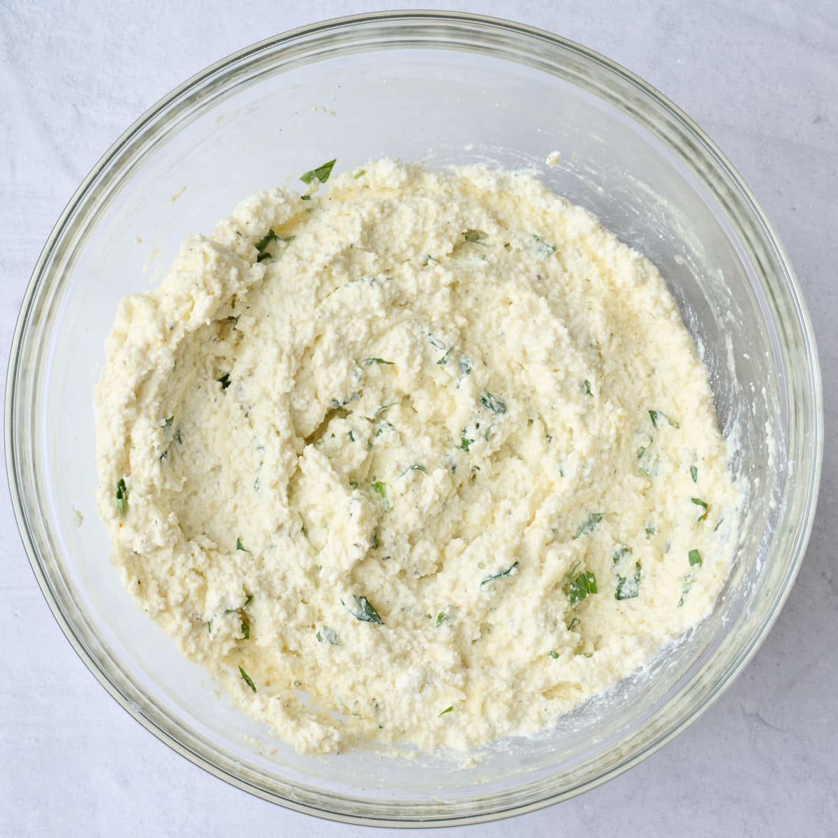 Manicotti filling in a bowl after mixing.
