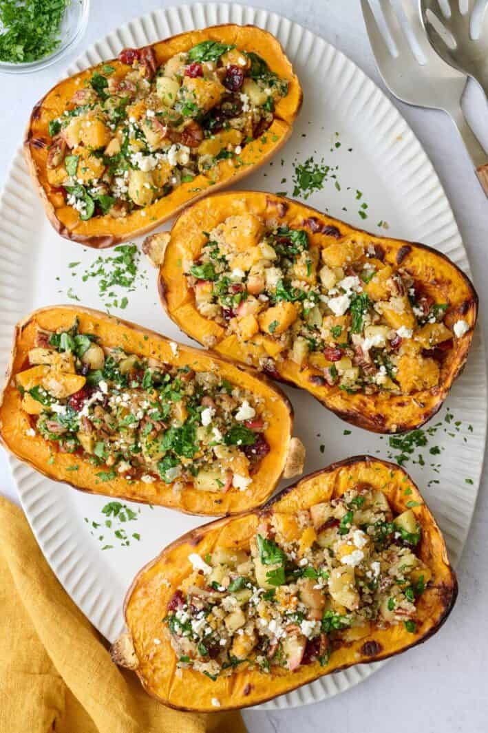 Easy stuffed butternut squash recipe filled with a quinoa, pecan, cranberry and feta filling.