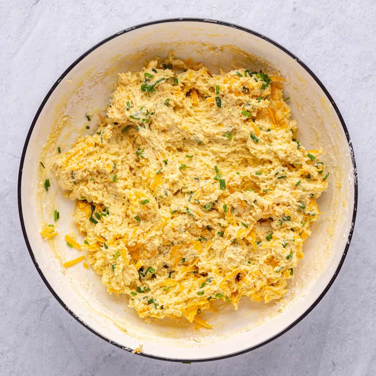 Cheesy biscuit dough after folding together.