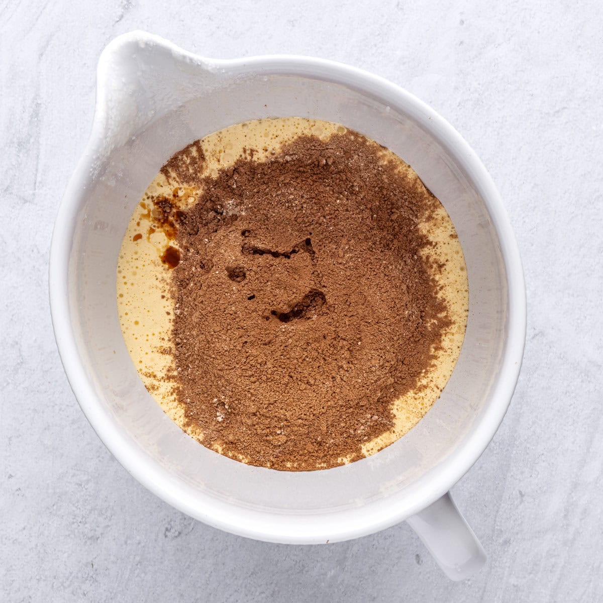 Vanilla and cocoa flour mixture added on top of wet ingredients before combining.
