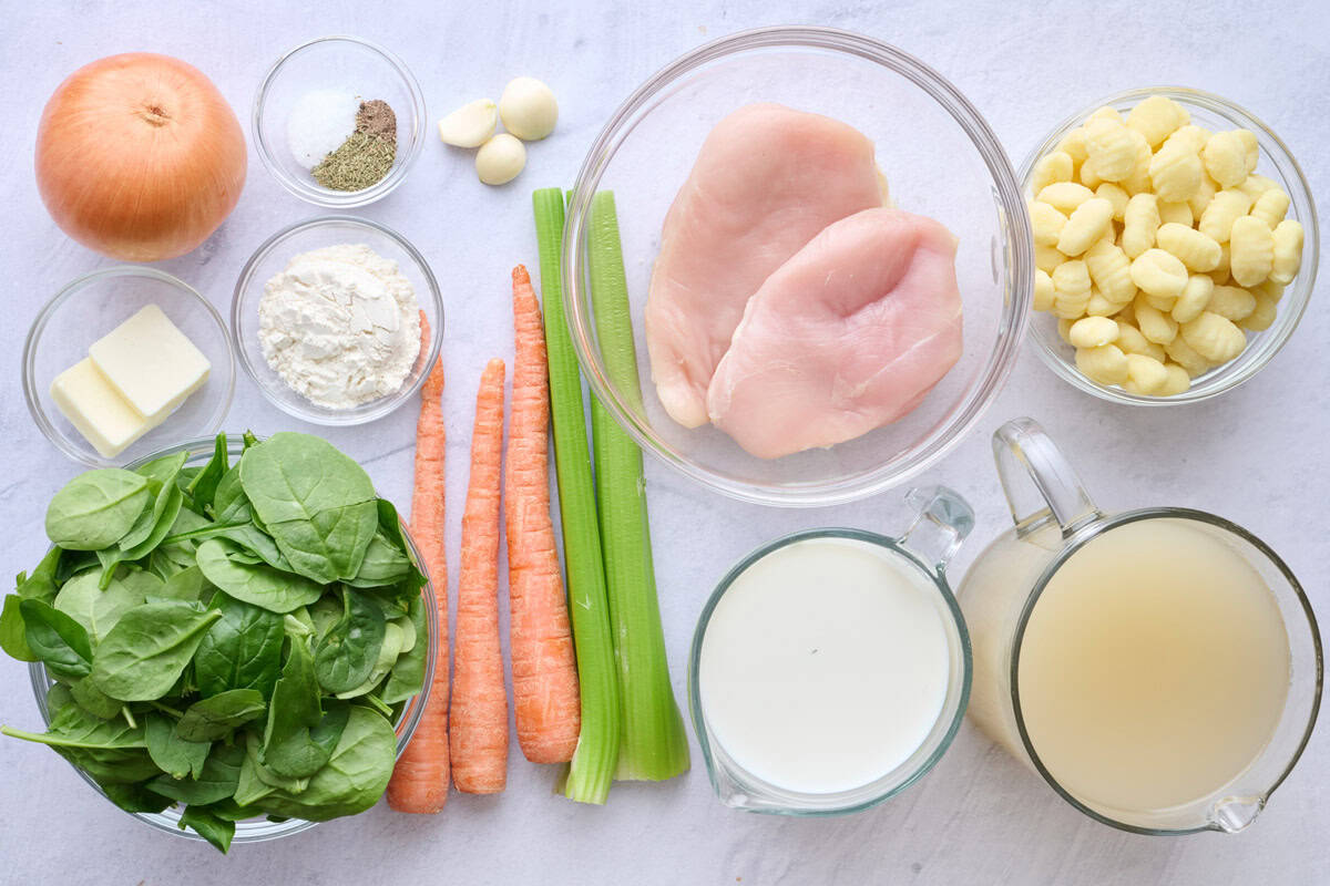 Ingredients for soup: onion, butter, flour, salt and pepper, garlic, spinach, carrots celery, chicken breasts, gnocchi, milk, and broth.