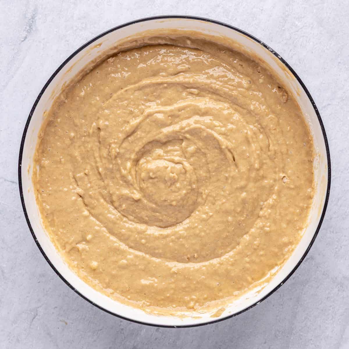 Banana bread batter made with cottage cheese after combining in a bowl.