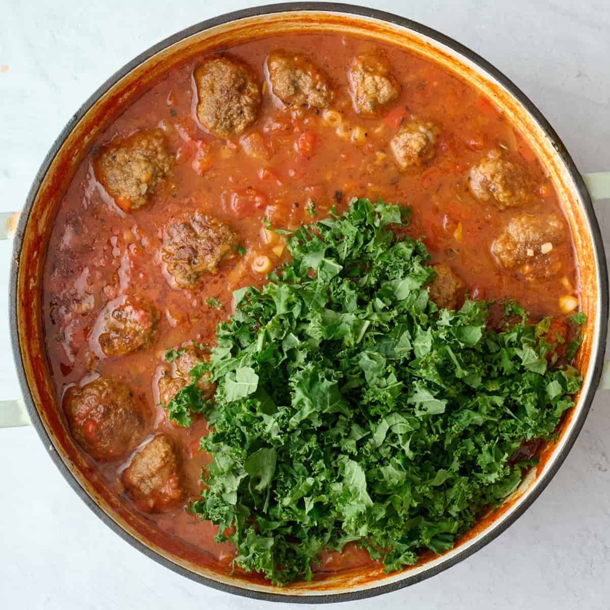 After cooking pasta in soup with chopped kale added on top.