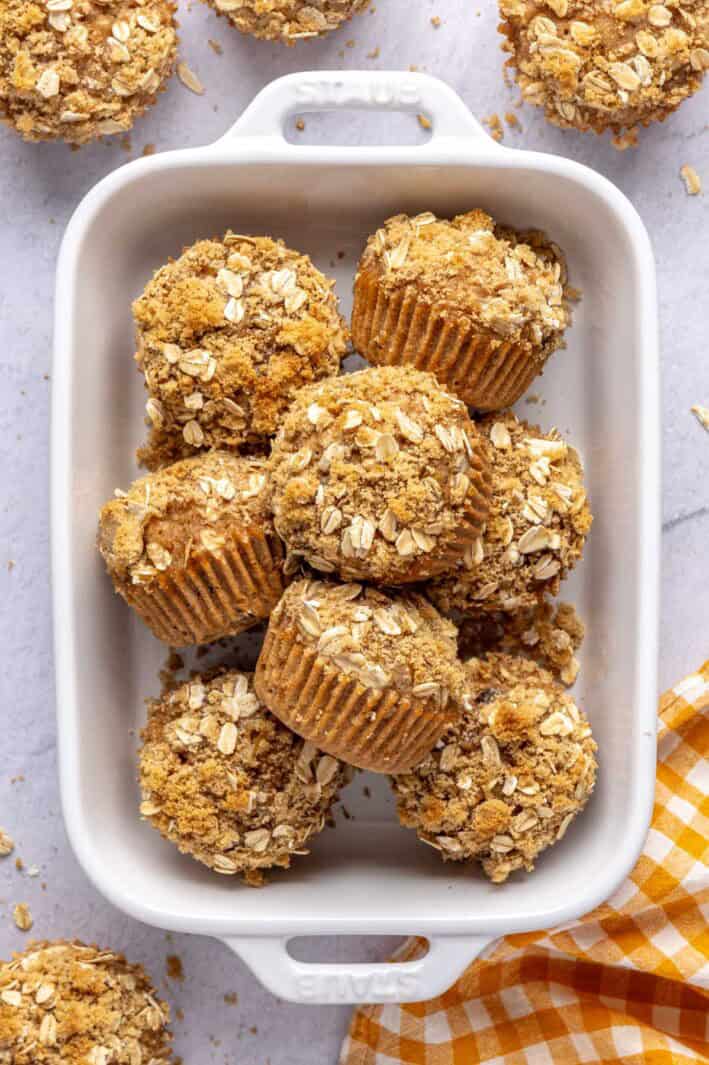 Oatmeal breakfast muffins with an oat crumb topping in a small dish.