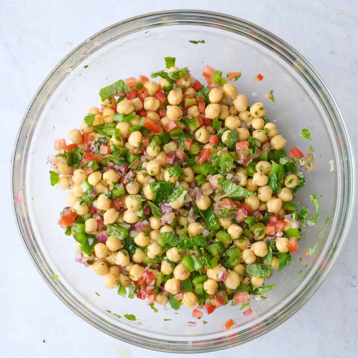 After tossing chickpea salad together with veggies, herbs, and dressing.