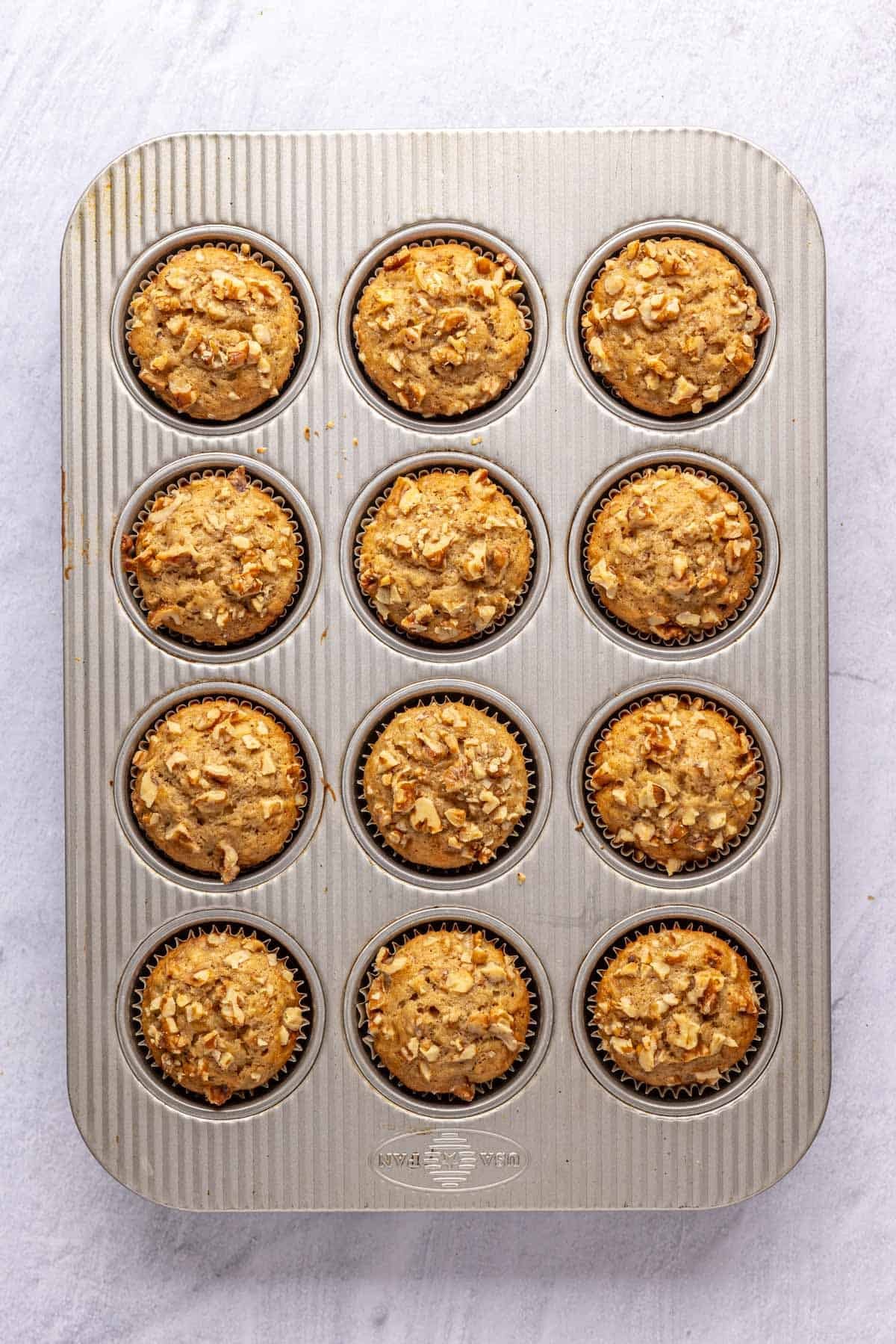 Homemade banana nut muffins with walnuts after baking.