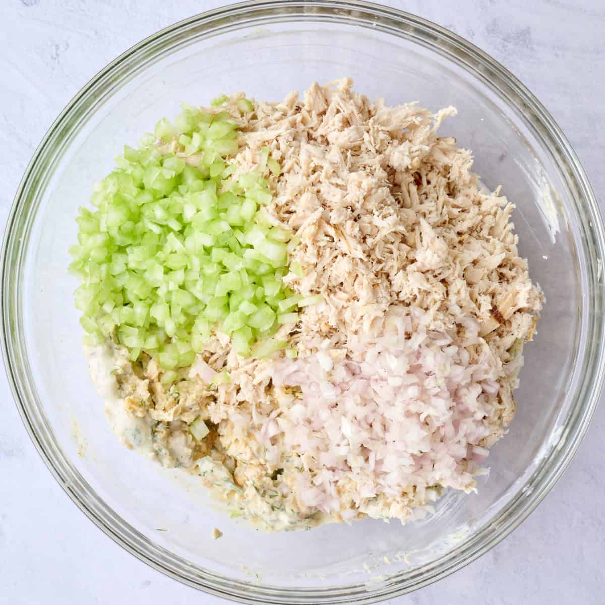 After mashing chickpeas and dressing together with chicken, celery and shallots added on top to side.