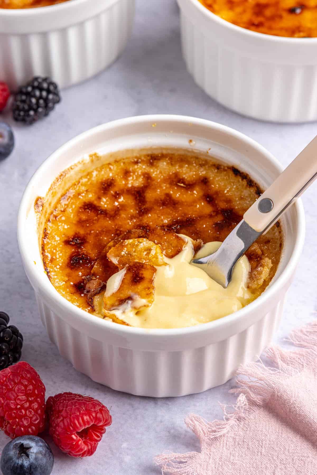 Easy creme brulee recipe after a cracking the sugar top and spoon dipped inside the creamy vanilla custard.