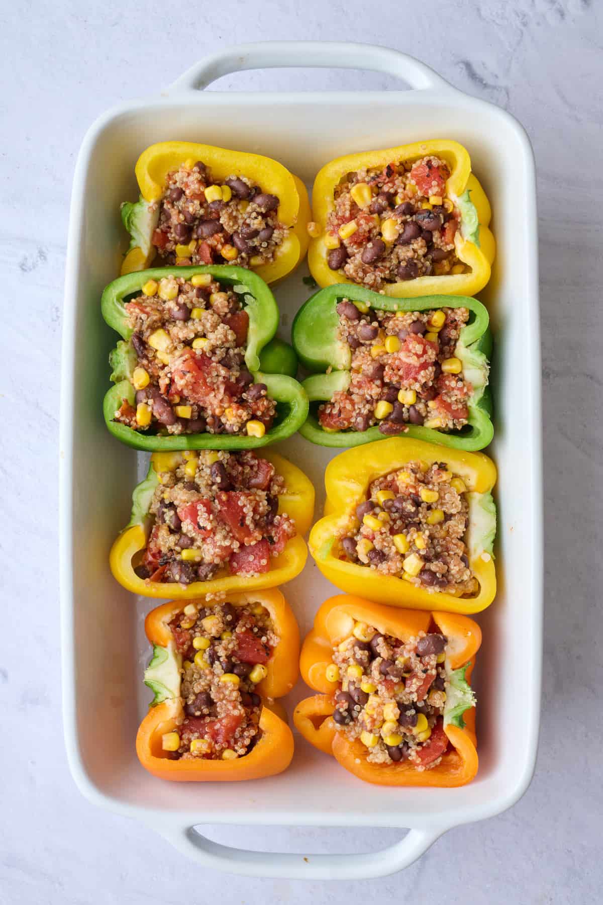 Quinoa filling stuffed into bell peppers.
