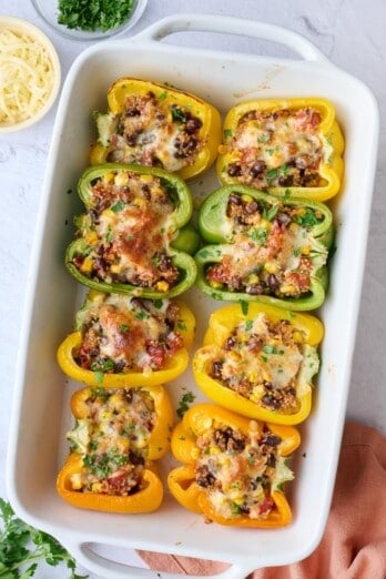 Easy vegetarian stuffed peppers with quinoa, corn, black beans, and tomatoes.