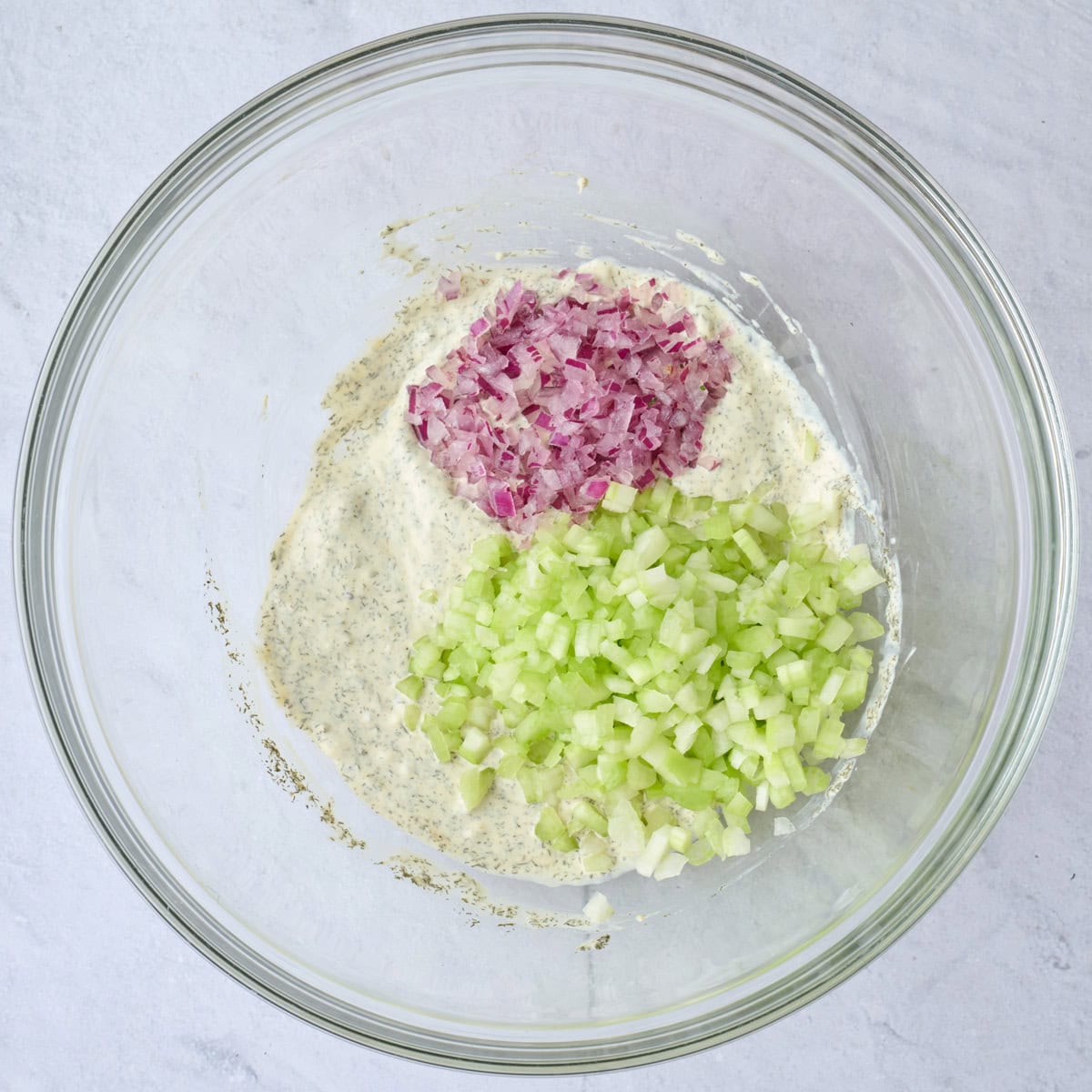 Salad dressing after mixed with celery and onions added.