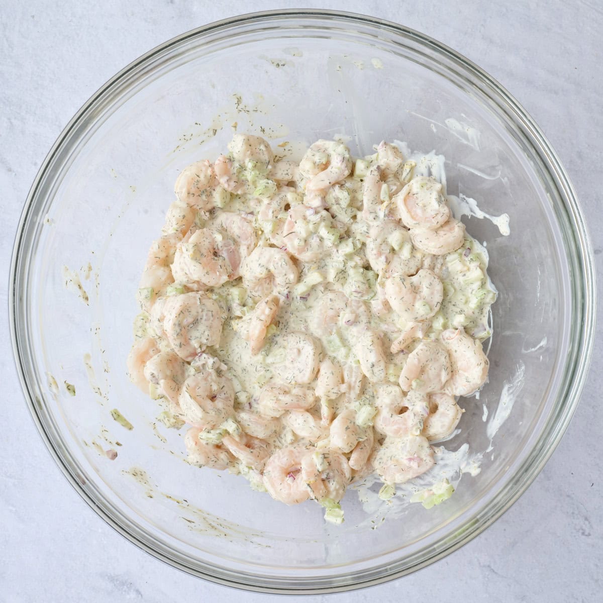 Creamy shrimp salad mixture after tossing together.