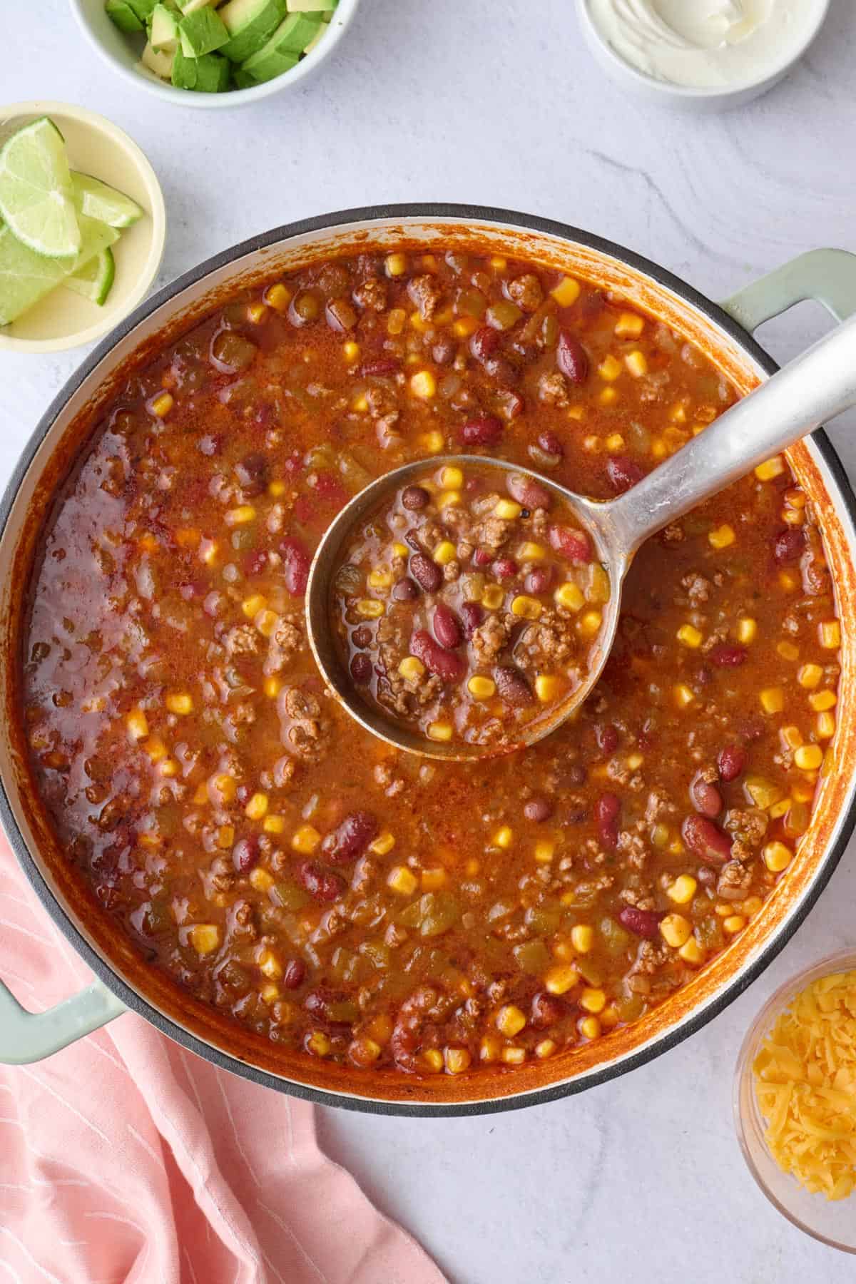 Best taco soup recipe in a pot made with ground beef, beans, and corn.