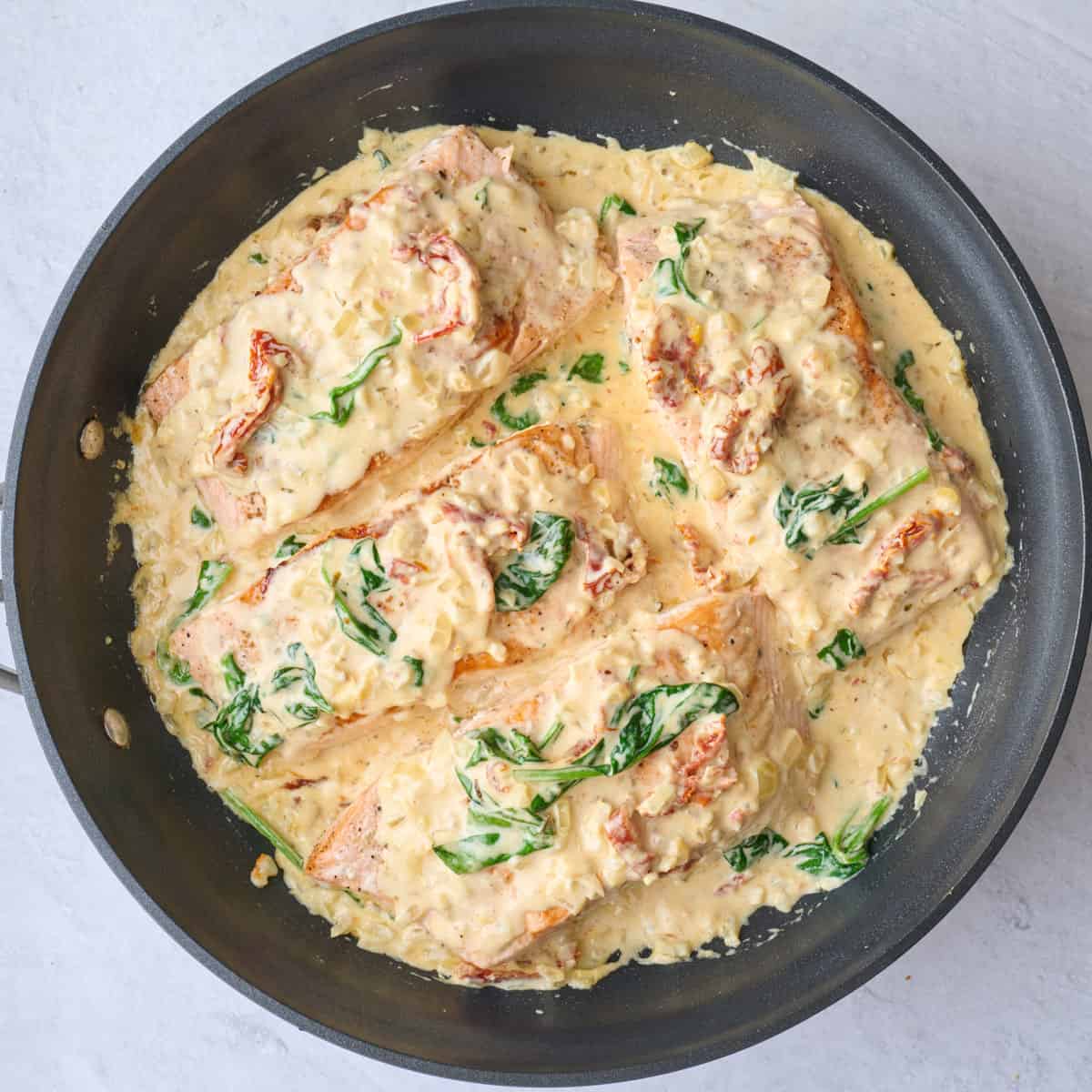 After coating salmon in creamy parmesan sauce.