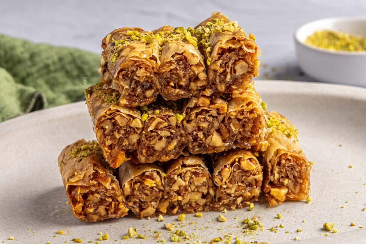 Homemade burma rolls stacks up to show the walnut filling inside.