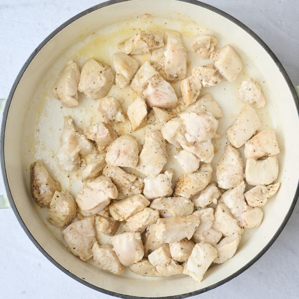 Seasoned chicken in pot after cooking it.