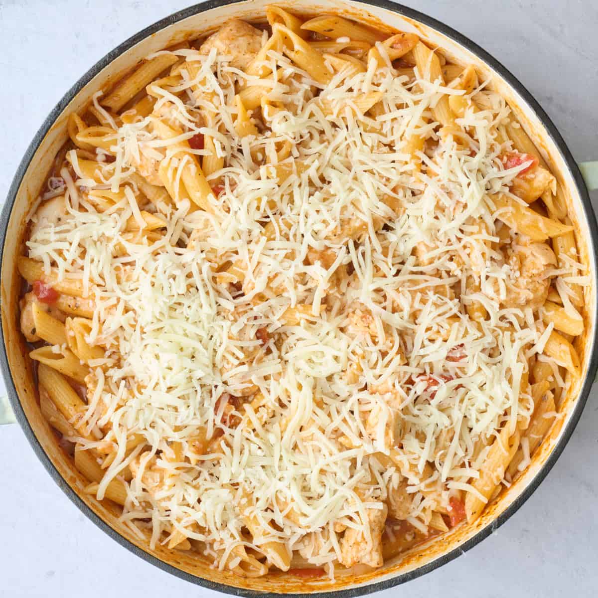 After combing all of the ingredients in the pot and sprinkling cheese on top.