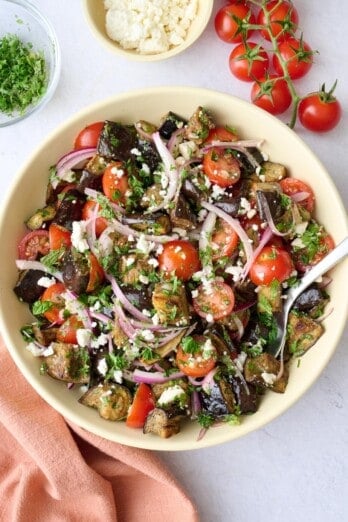 Mediterranean eggplant salad made with tomatoes, onions and herbs, tossed with a bright dressing.