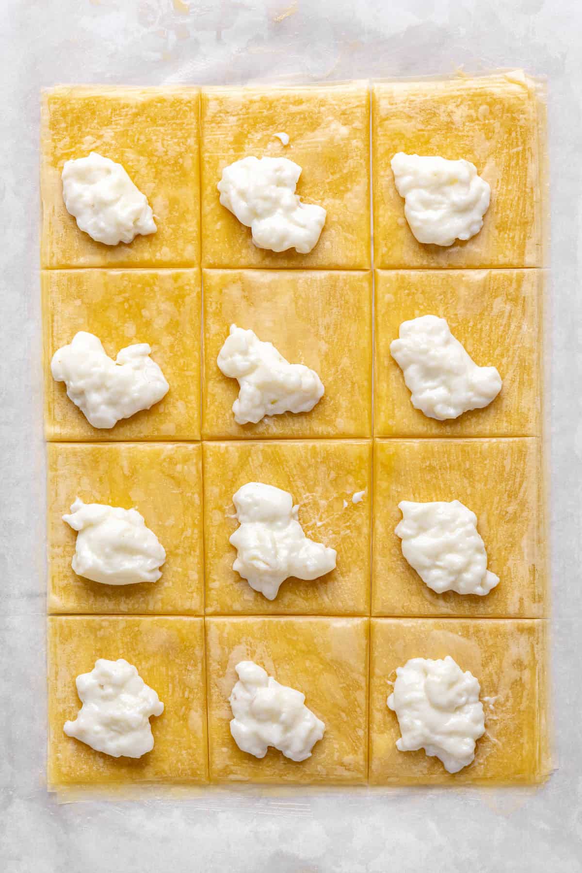 A dollop of ashta on each phyllo square.