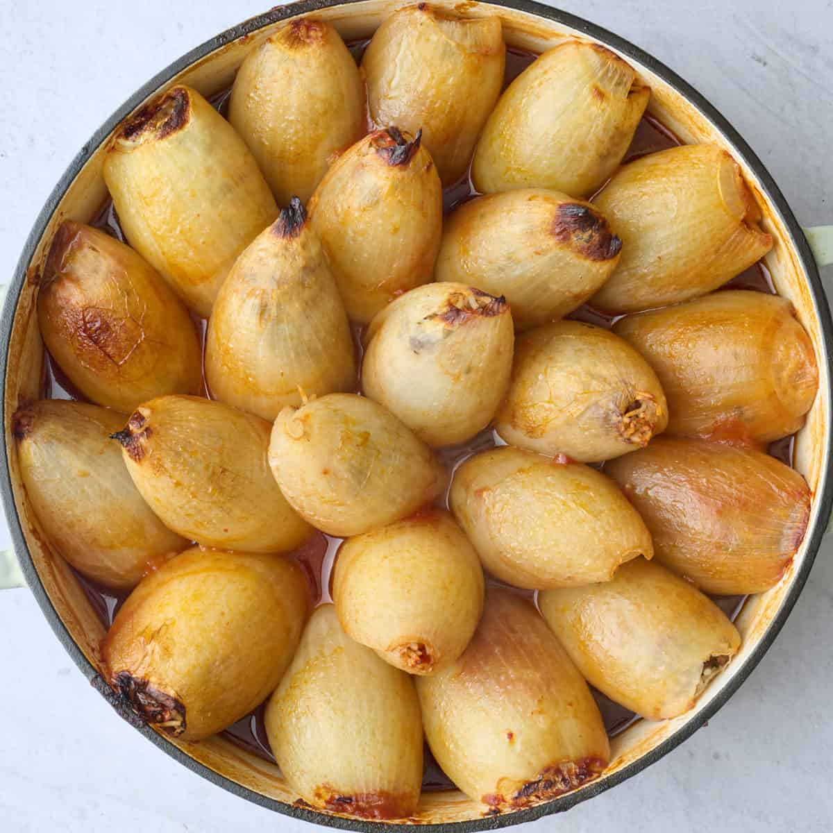 Stuffed onion recipes with ground beef and rice after baking.