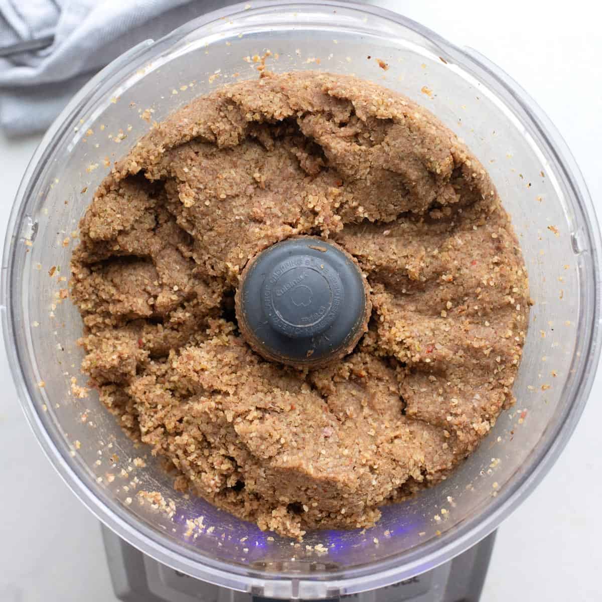 Ground beef bulgur mixture after processing into a thick paste.