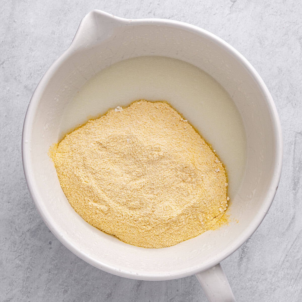 After combining and sugar is dissolved with flour mixture added .