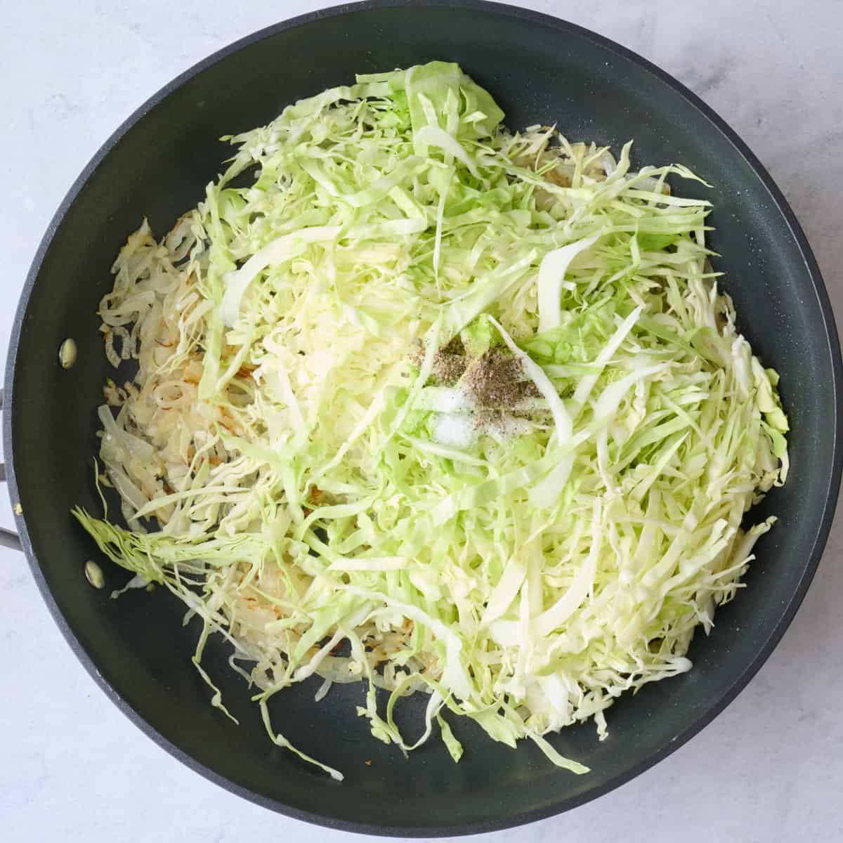 Cabbage, salt and pepper added before cooking.