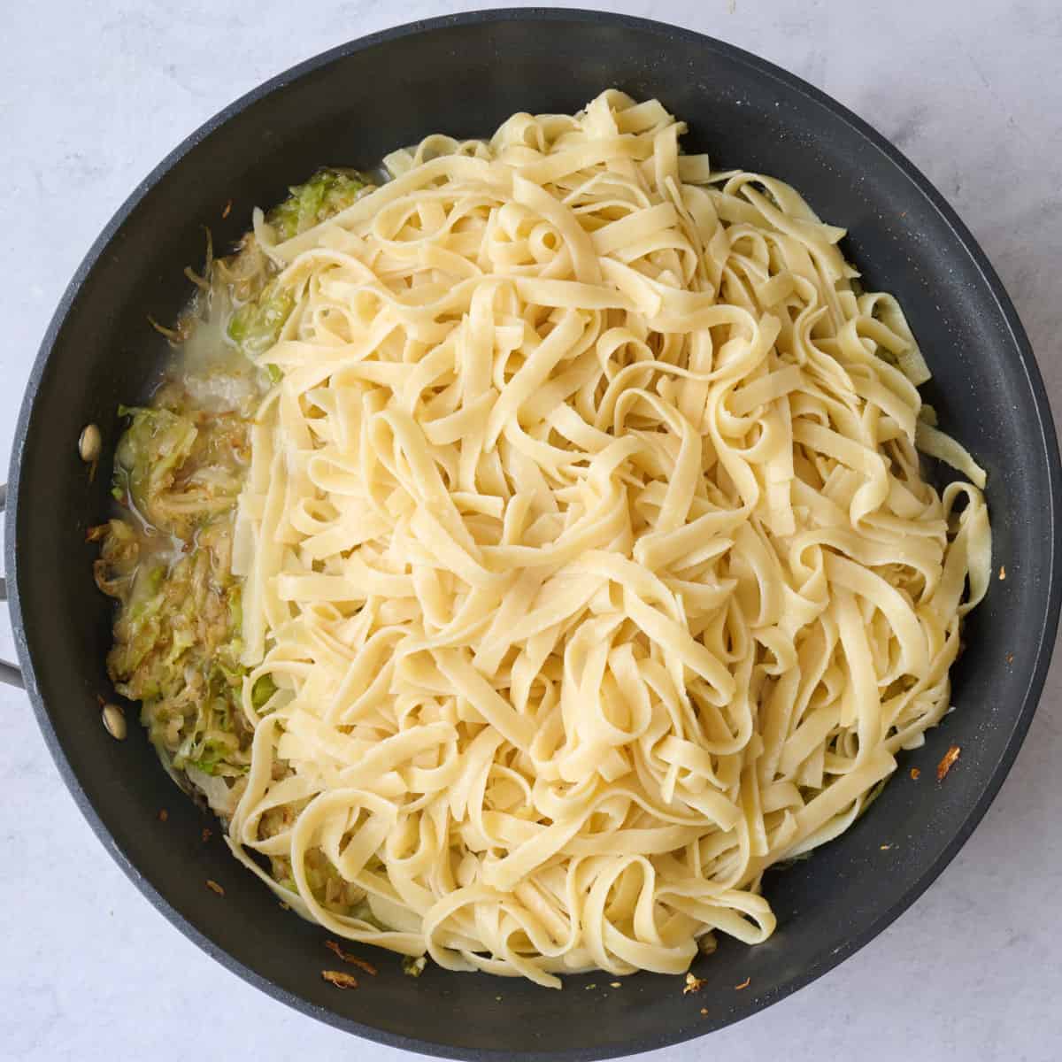 Cooked pasta, 1 cup pasta water added before tossing together.