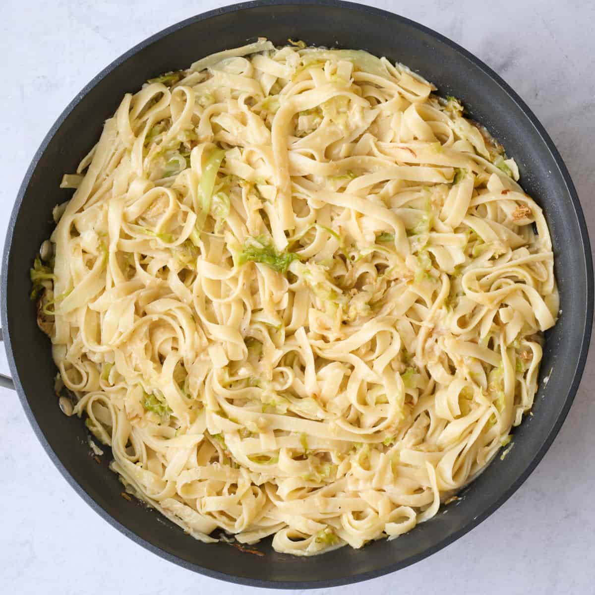 After tossing with parmesan cheese.