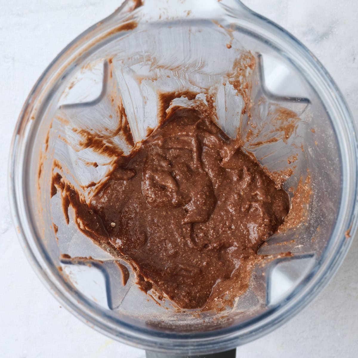 Chocolate pancake batter with protein powder after blending in the blender.