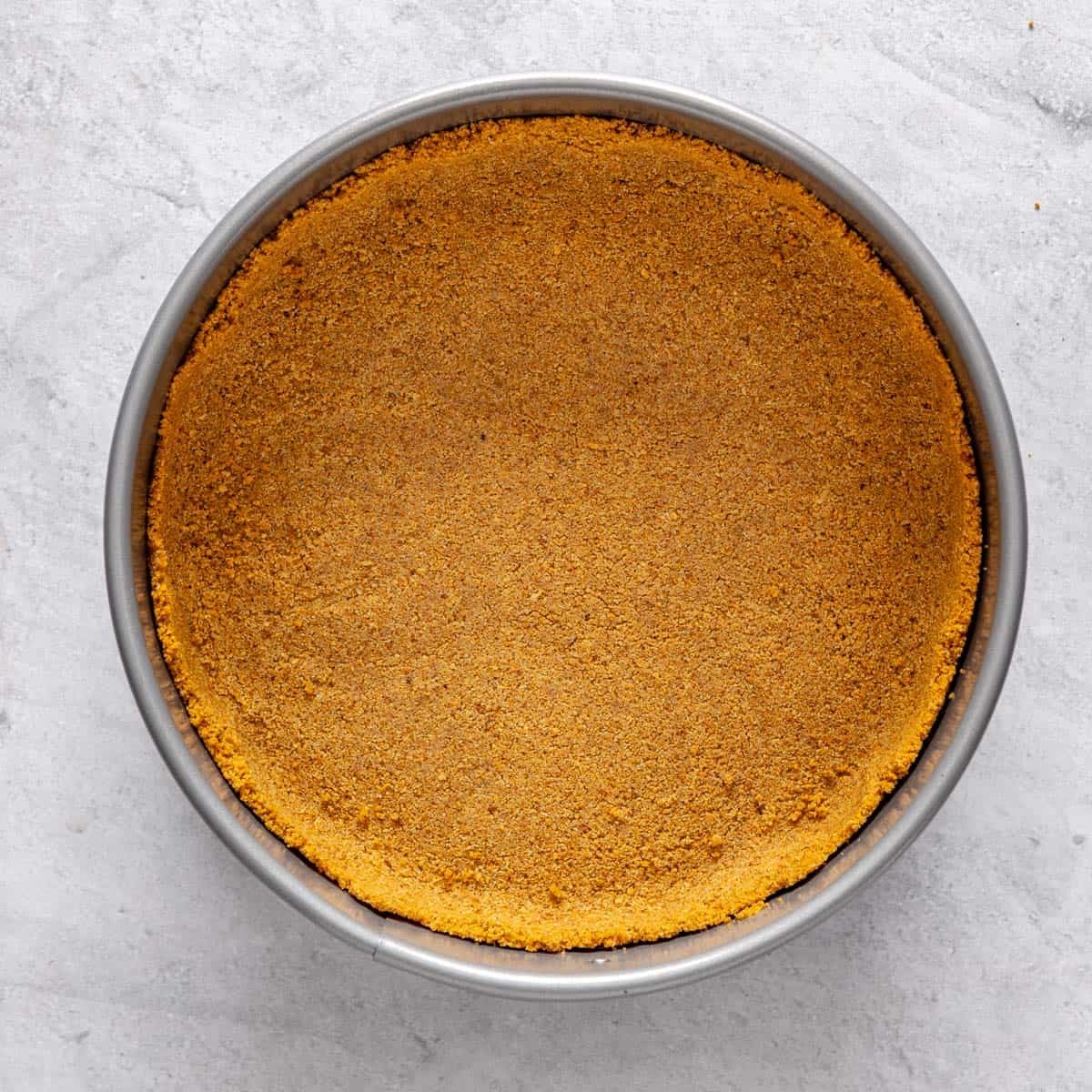 The pan with the crumb layer fully pressed in.