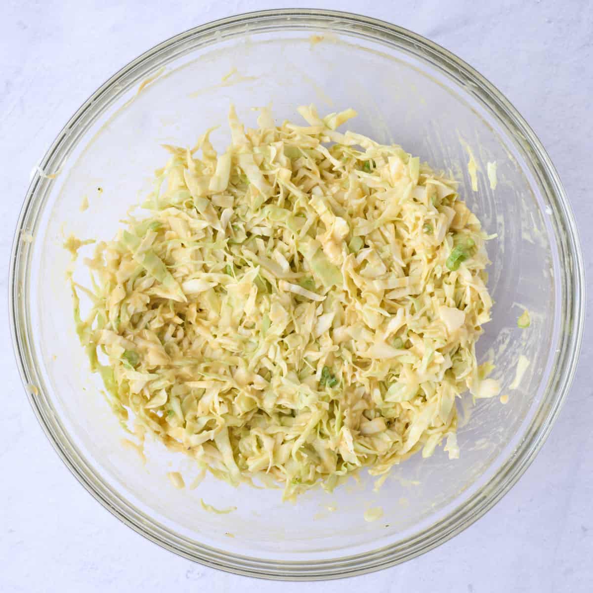 After stirring all of the batter ingredients until the cabbage is evenly coated.