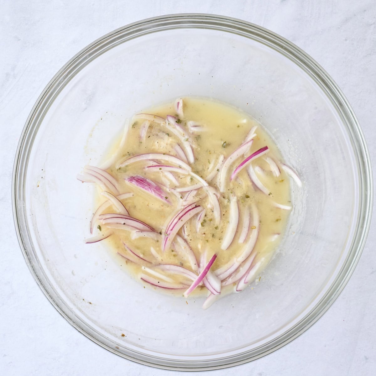 Onions added to remaining dressing in bowl.