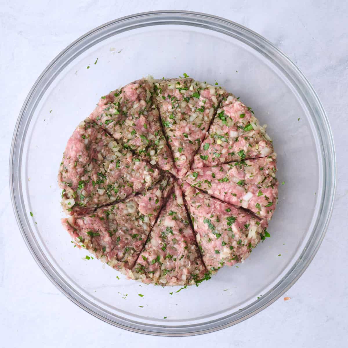 Lamb mixture after just combined and divided into 8 equal portions.