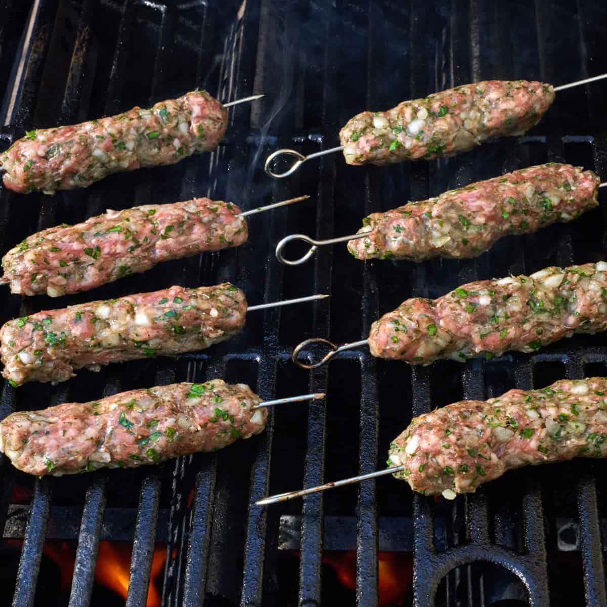 Lamb kabobs on a grill.