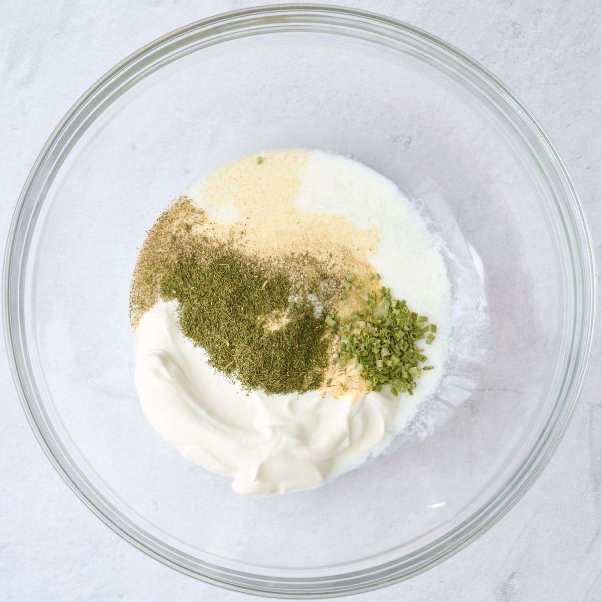 Dressing ingredients in a small bowl before mixing.