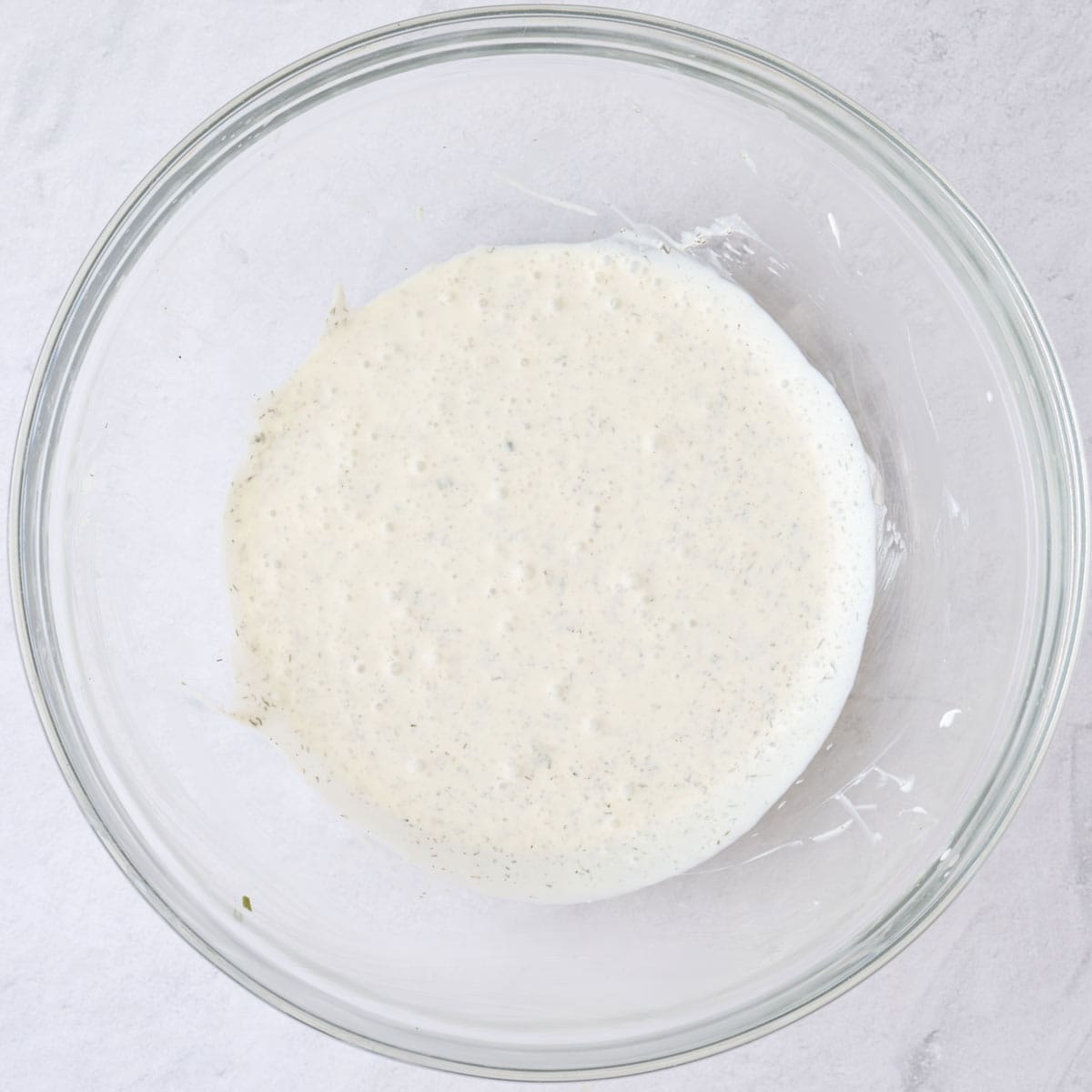 Dressing ingredients in a small bowl after combining.