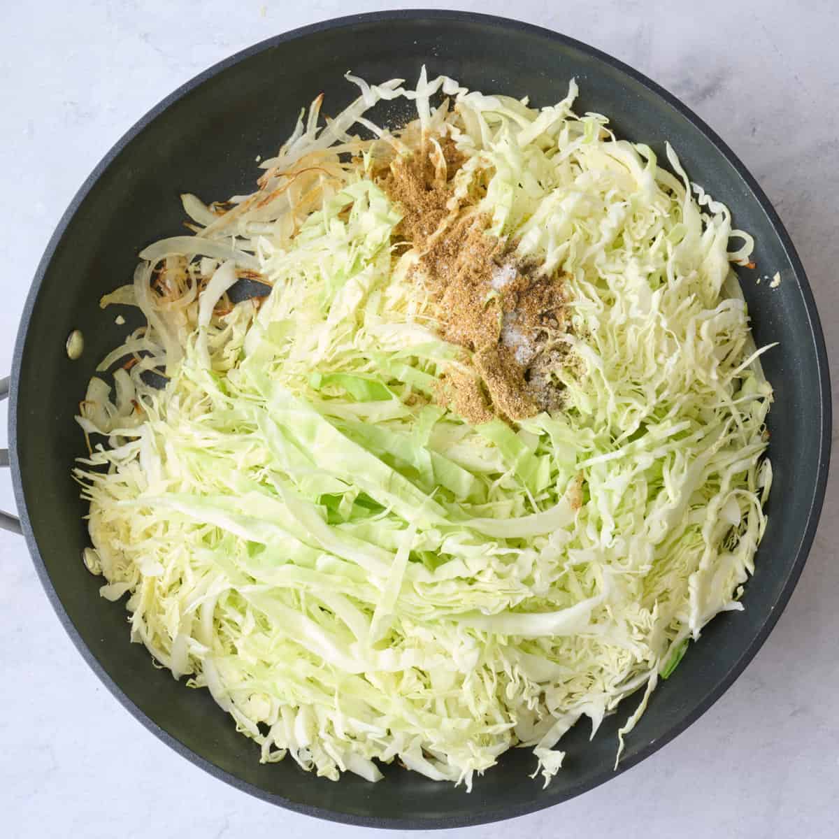 After cooking with cabbage, cumin, coriander, salt and pepper added before combining.